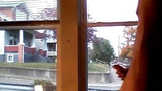 Nua na janela porra
