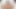 A girl masturbates on the bed with her fingers and brings herself to orgasm