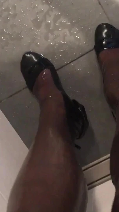 Iconic moment from "Fetish Crossdresser pissing on Latex Stockings"