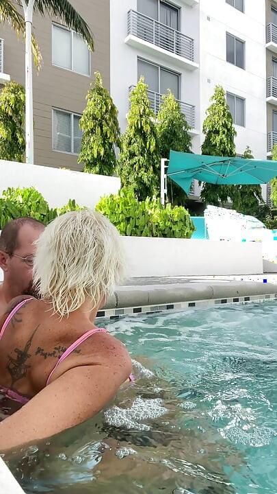 Getting frisky in the hot tub. Boob play.