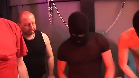 Mature Redhead Squirts Wildly in Intense Group Domination Session