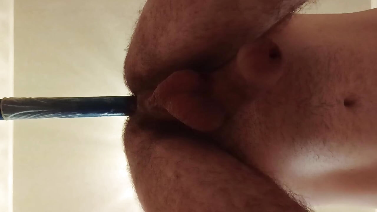 Hairy gay slut riding a dildo.