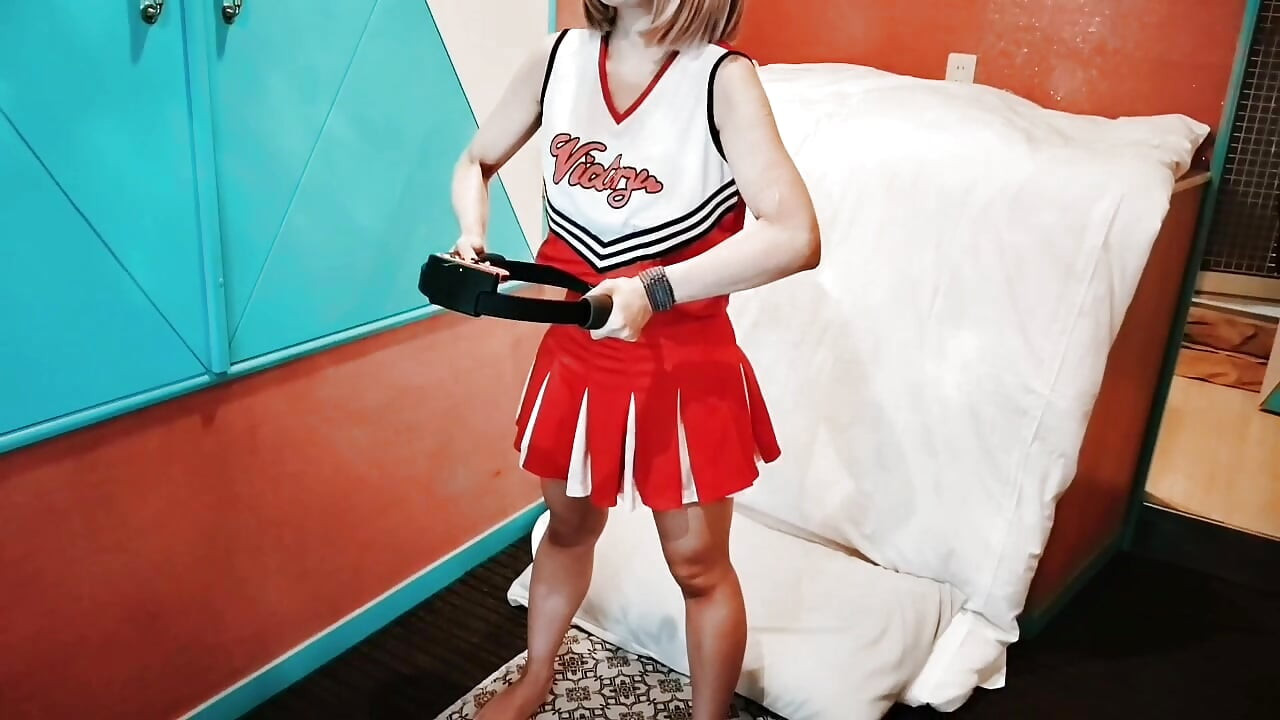 A cute, busty married woman does exercise 1 in an erotic cheerleader costume. Home made amateur Private Shoot