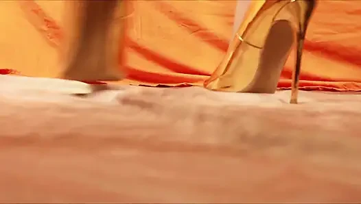 Giantess Shows off Gold High Heels