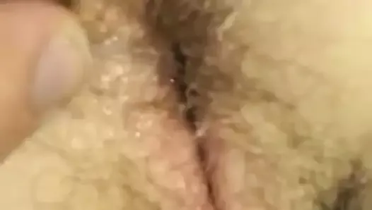 Fingering hairy pussy from behind