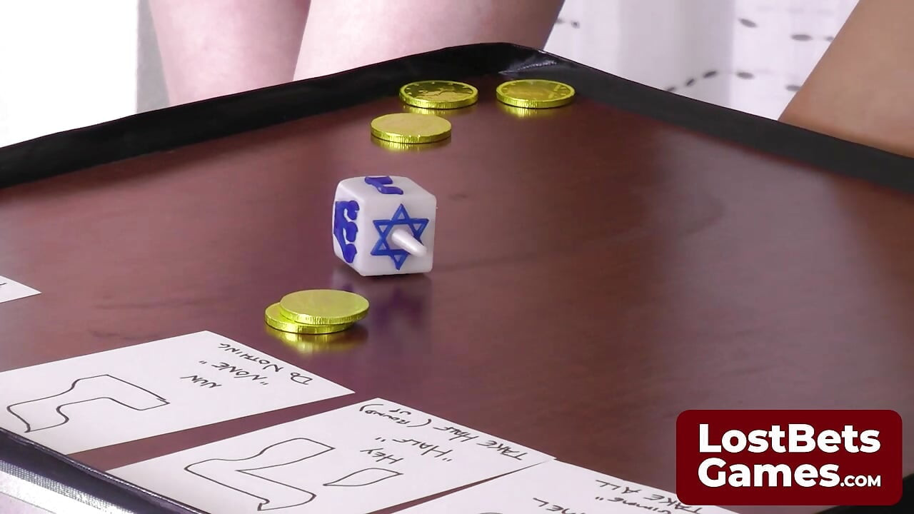Experience a Strip Dreidel game with three gorgeous babes