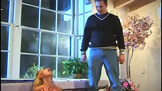 Naked blonde masturbates in hot pool while man with pantyhose on his head watches