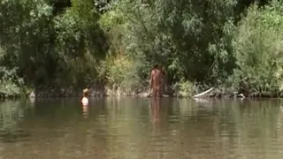 NATURIST MATURE COUPLE AT THE RIVER