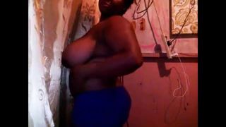 Chubby black woman shows her huge saggy tits