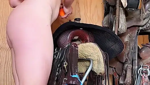 Redhead Rides BBC Dildo on Farrier Stand in Ass and Pussy Squirting
