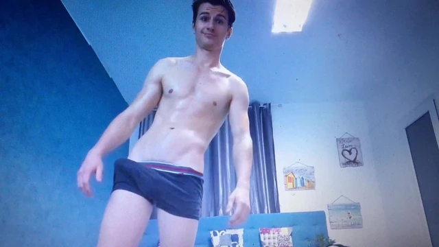 Cute young muscle guy in shorts with huge bulge in shorts