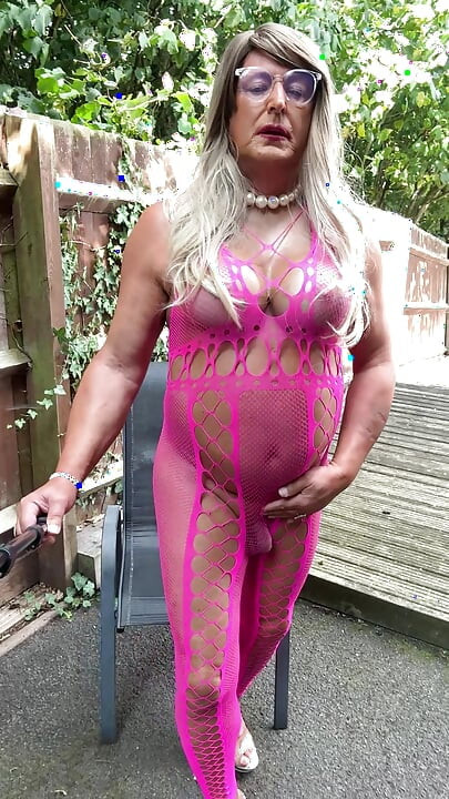 Sexy Crossdresser Kellycd2022's in pink fishnet catsuit and heels