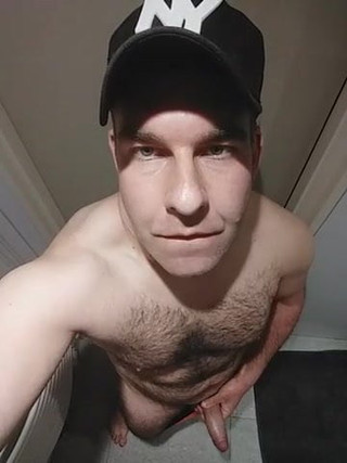 Hairy daddy strokes his cock with eye contact