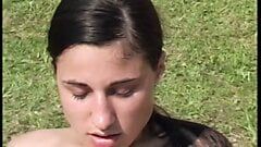 Sensual brunette gets screwed lying on the lawn