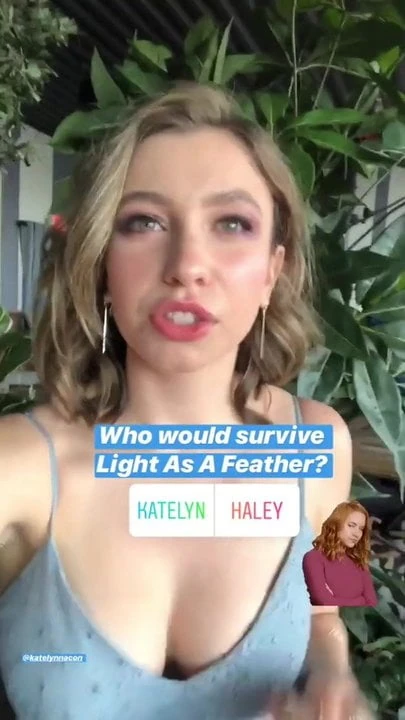 Katelyn Nacon outside in a blue dress, nice cleavage