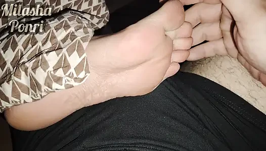 Stepsister's feet get a light massage while watching a movie