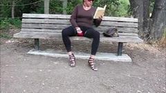 Lovely crossdresser jerks it on a park bench