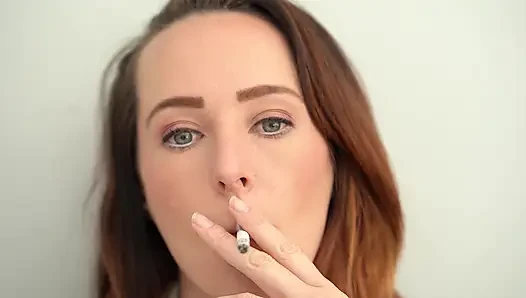 Extreme Close up Blue Eyed Redhead Smoking