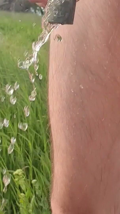 Outdoor walking and pissing locked in chastity device with urethral plug | Clip 1