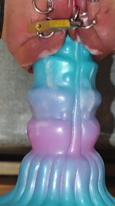 Pumped pierced pussy rides dildo despite lock | Clip 1
