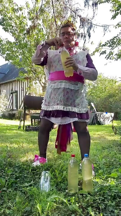 In gardener's outfit to take a piss shower with 4 bottles