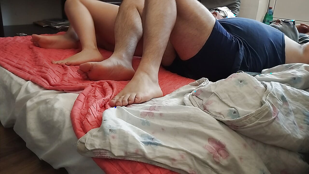 Foreplay in the bedroom with an amateur couple.