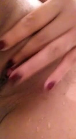 Masturbating