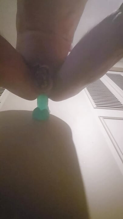 Caged sissy taking huge dildo