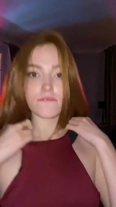 Redhead in a red dress