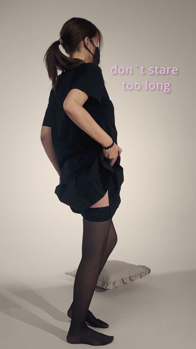 Faceless masked girl lifting black miniskirt – slow tease