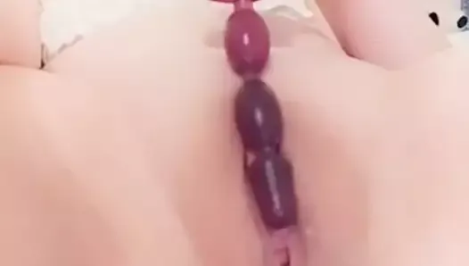 sliding anal beads into my cute innie pussy