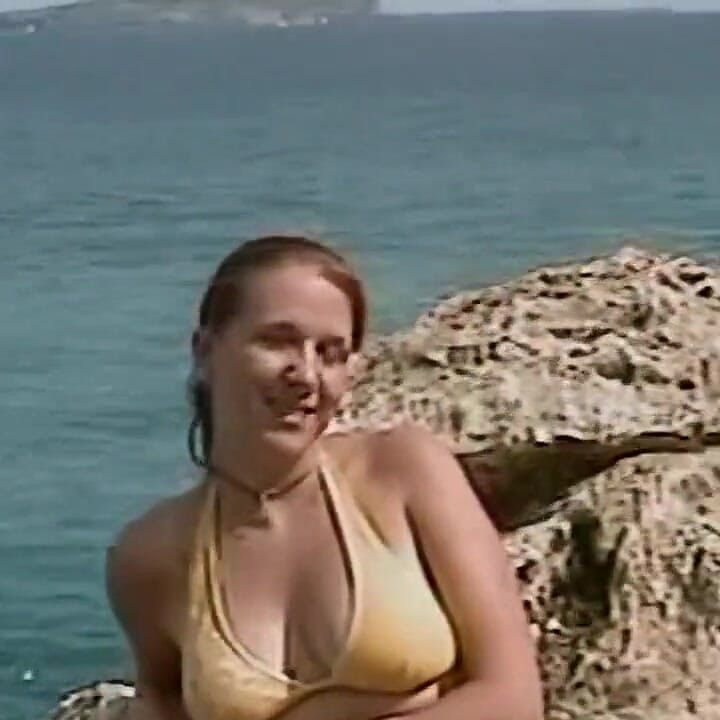 Horny Redhead Babe Fingers Pussy on Wild Beach