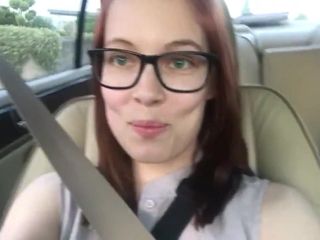 Girl in glasses farts in her car