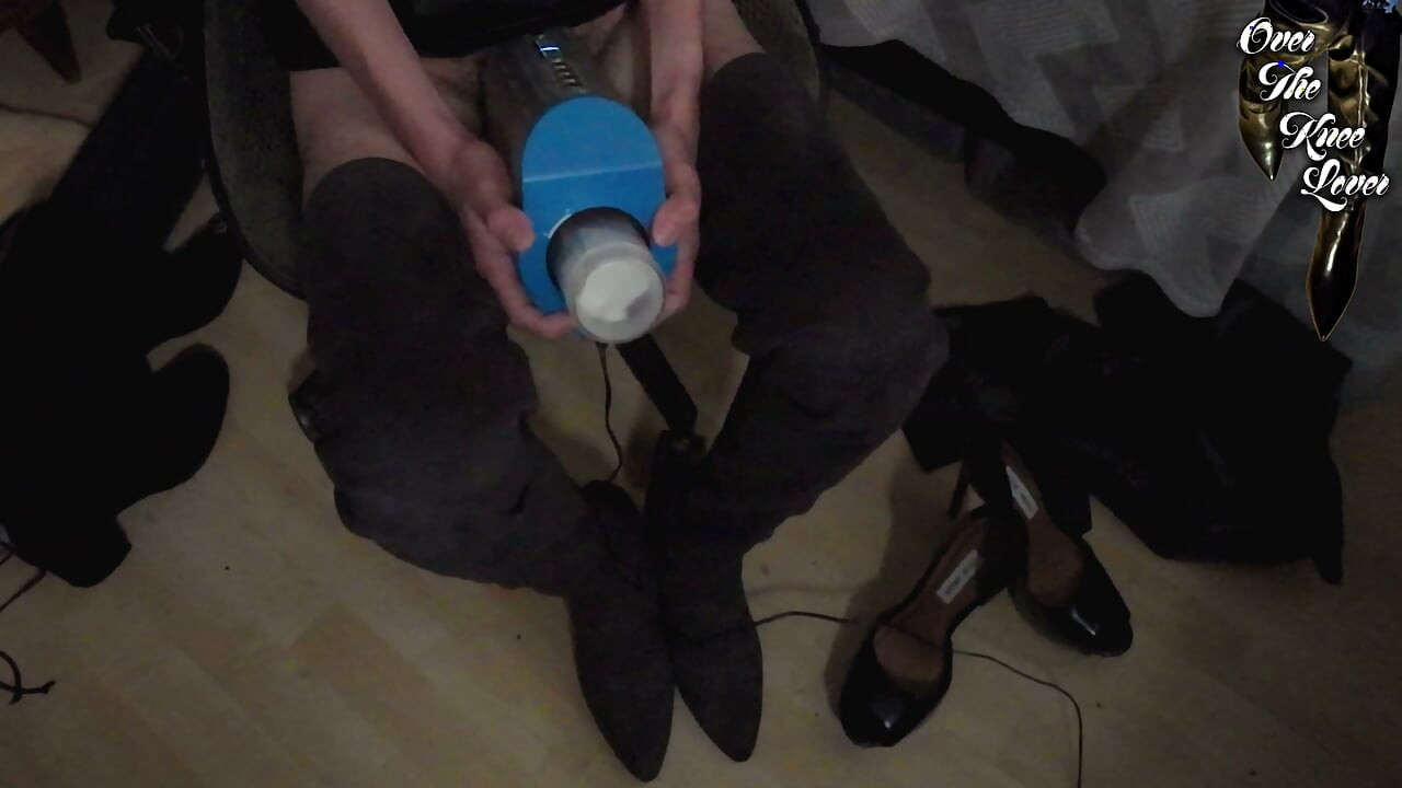 crossdresser autoblows in a leather dress and suede thigh high boots