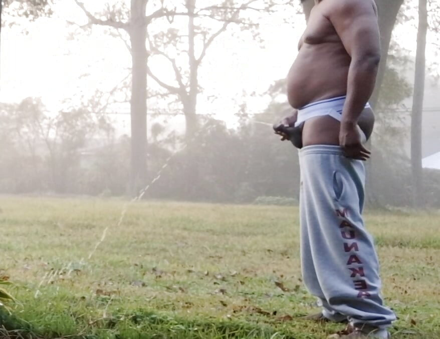 Taking a quick piss in the yard