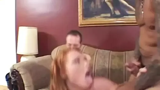 Redhead with a illusion fucks two huge cocks on bed