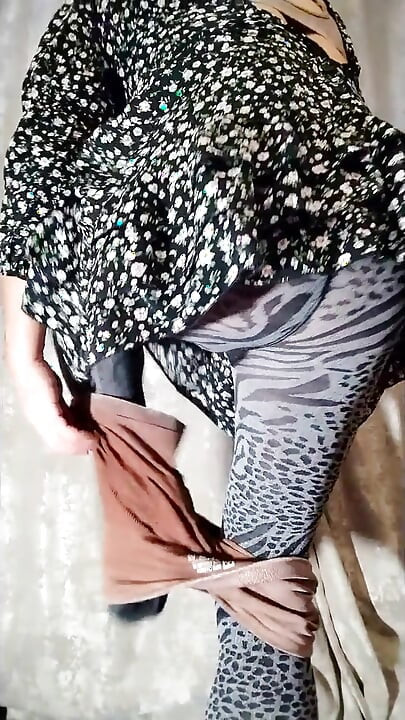 Sissy poses in fitness clothes, tights, and a short dress