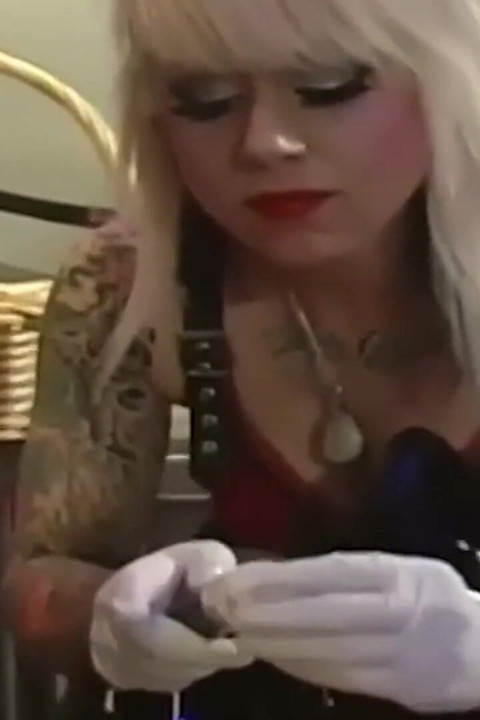 Tattooed Latex Mistress Dominates Her Collared Male Slave
