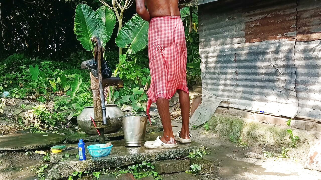 Desi young man bath Open place.