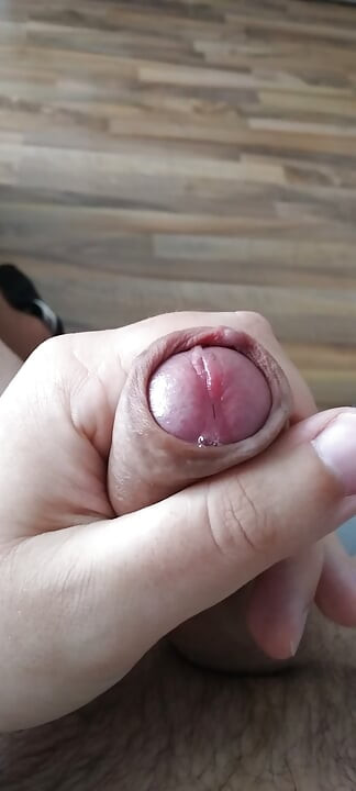 Horny young man massages his cock and cums lustfully