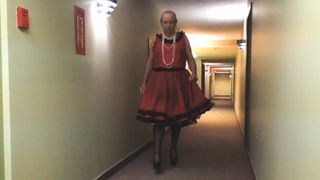 Sissy Ray in Red Sissy Dress in hotel hallway