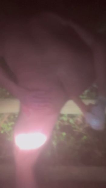 Playing naked with a dildo at night