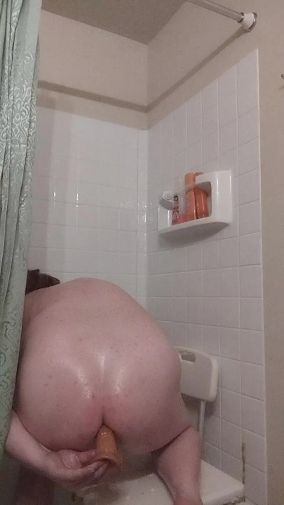 Shower slut takes dildo deep in ass