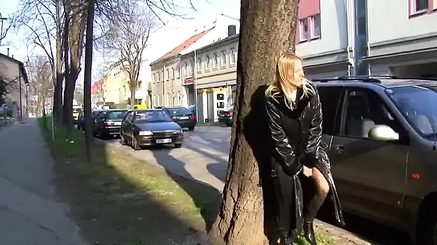 Blonde bitch pissing on the city street