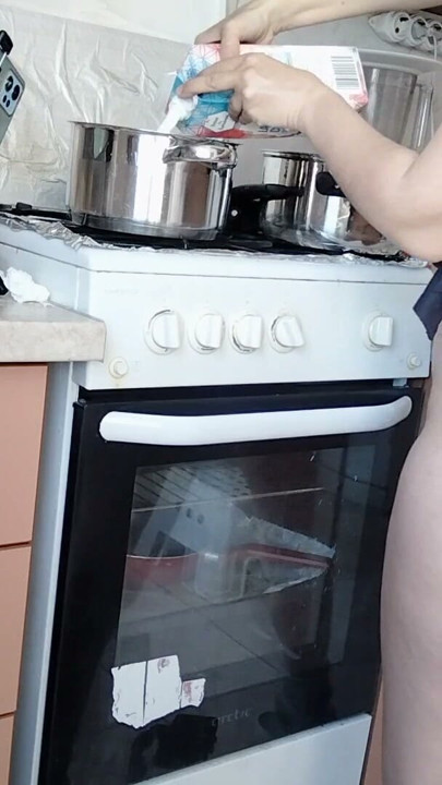 Sexy Latina nude in the kitchen. Sexy naked wife prepares food in the kitchen. | Clip 1