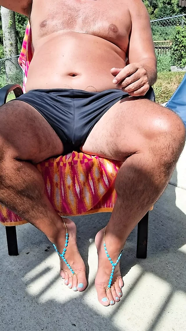 Sitting in my back yard getting a tan while showing off my cock and Gf's barefoot sandals