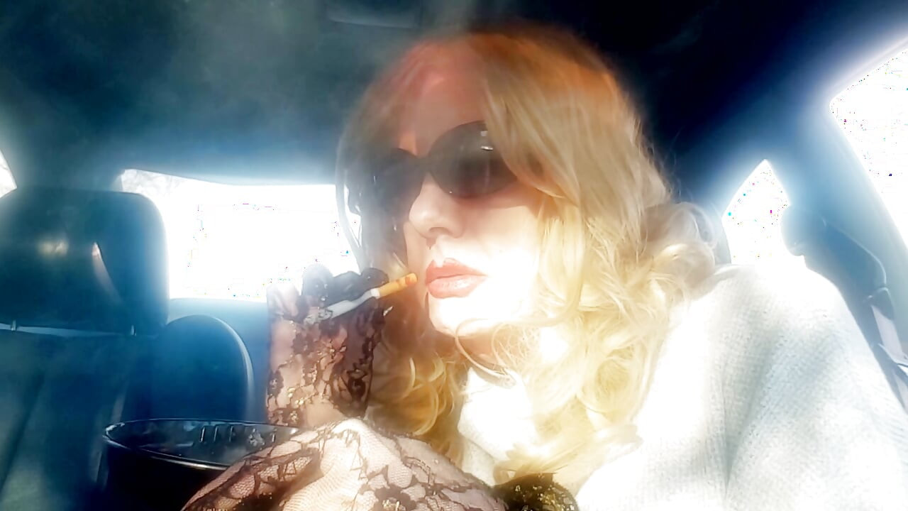 MRS. ROMAN SMOKING MARLBORO 100's IN HER CAR
