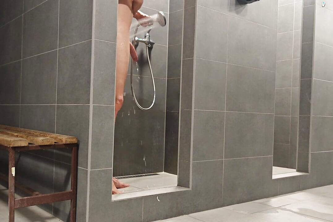 Young skinny box Is showering And recording himself in public bathroom