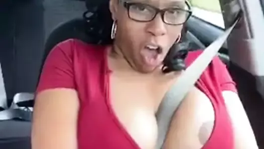 Solo ebony Desiree Desire flashes her tits while driving
