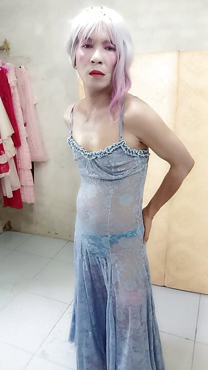 Oanh Le shemale eyes sexy dress porn standing with a happy cock leaning on her back